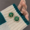 French retro green H-letter stud earrings with a light luxury and niche design, exuding a sense of sophistication and elegance. 925 silver needle earrings for women details Picture